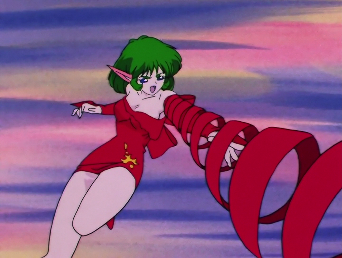 Now we see Scar’s true form, and she’s actually cute! She has green hair and blue eyes, and very pointed ears. Plenty of monsters have these but they’re very pronounced with Scar. She’s attacking by releasing a ribbon-like coil of fabric from her arm, like the arms in ARMS. Either that last bit made perfect sense to you, or no sense at all.